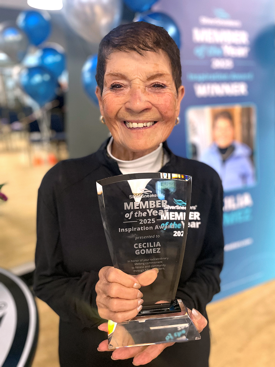 A woman holding an award.