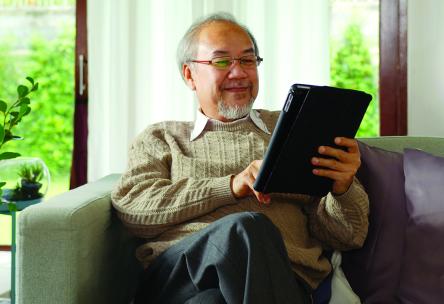 A man holding a tablet.