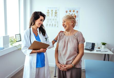 A doctor talking to a woman.