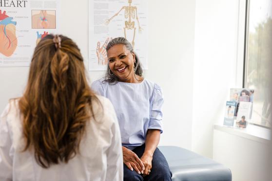 A woman sitting in a doctor's office.